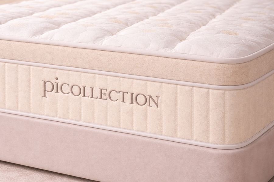 Détail du tissu et de l'étiquette du matelas Picollection Blanc
